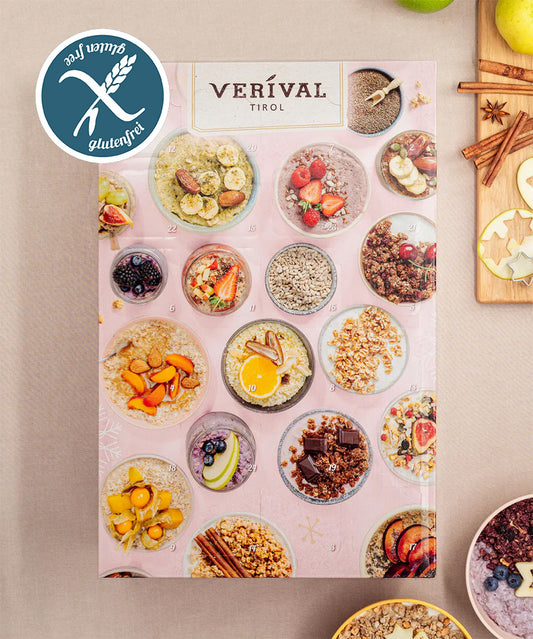 Die Adventskalender-Box Glutenfrei von Verival Bio zeigt glutenfreie Frühstücksbowls mit Früchten, Nüssen und Haferporridge auf rosa Hintergrund. Das Glutenfrei-Label ist in der oberen linken Ecke hervorgehoben und somit gut sichtbar.